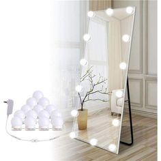 an image of a mirror with lights on it in the middle of a living room