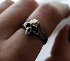 Skull Ring Men Version Materials: 925 sterling silver This Ring is made entirely by hand. give me time to do it for you Please note that actual colors may vary slightly from their appearance on screen. For more information, please visit my shop policies. If you have any questions, please do not hesitate to contact me. Delivery of the world Minimal Skull, Ring Men, Skull Jewelry, Tiny Hand, Skull Ring, Ring Sterling Silver, Stackable Rings, Me Time, Shop Policies