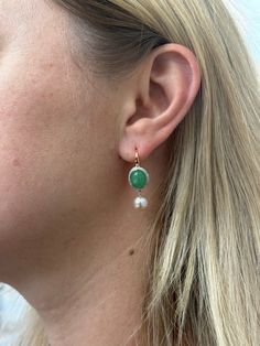 Pair of Mimi Milano Leela earrings, with approx. 0.16ctw G/VS diamonds, jade and 8.8m pearls. Retail $4030. DESIGNER: Mimi Milano MATERIAL: 18k Gold GEMSTONES: Diamond, Pearl, Jade DIMENSIONS: Earrings are 33mm x 11mm. MARKED/TESTED: Mimi mark, 750, Italian mark. WEIGHT: 8.5 grams CONDITION: New/Store Sample Luxury Green Jewelry With Pearl Drop, Elegant Single Jade Earring, Yellow Gold Pearl Charm Earrings Fine Jewelry, Gold Meenakari Drop Pearl Earrings, Yellow Gold Jade Drop Earrings, Luxury Yellow Gold Mother Of Pearl Earrings, Yellow Jade Earrings, 18k Gold Earrings, Color Pairing