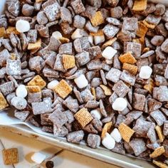 a baking dish filled with marshmallows and graham crackers in the middle