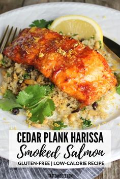 cedar plank harissa smoked salmon with lemon and cilantro rice on a white plate