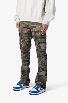 the Bootcut Cargo Pants are designed with our new B fit, which is slim through the thigh and features a slight flare at the leg opening and is constructed from washed camo twill, with a vintage wash and paint splatter, and finished with a contrasting camo panelling. details flare at leg opening 100% cotton model is 6’1 Casual Paint Splatter Streetwear Bottoms, Urban Style Cotton Bottoms With Paint Splatter, Urban Cotton Bottoms With Paint Splatter, Urban Style Paint Splatter Cotton Bottoms, Camouflage Straight Leg Cotton Cargo Jeans, Camouflage Straight Leg Jeans For Streetwear, Urban Camouflage Straight Leg Cargo Pants, Urban Camouflage Jeans For Streetwear, Fitted Camouflage Cargo Pants For Streetwear