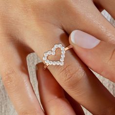 This 14k Gold dainty heart ring is perfect for everyday wear. You can wear it alone or as a stacking ring.* Personalized inscription available.** Half and quarter sizes available. *** Please add the ring size as a note to your order at checkout.__________________________________________M A T E R I A L & L E N G T HAvailable in 14k Yellow Gold, 14k Rose Gold, 14k White Gold, 18k Yellow Gold, 18k Rose Gold, 18k White GoldBand width: 1.7 mm Stone: 18 Natural Round DiamondsDiamond size: 1.9 mm Carat Heart Ring Design, Heart Ring Gold, Diamond Heart Ring, Engraved Ring, Gold Diamond Jewelry, Special Jewelry, Copper Color, Stacking Ring, Engraved Rings