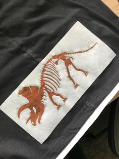 a t - shirt with an image of a dinosaur on it