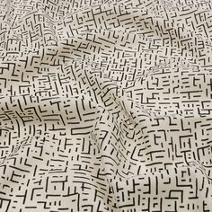 a black and white pattern is shown on a sheet that looks like it has been made from