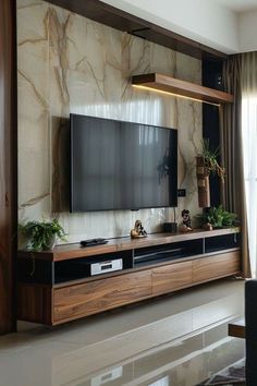 a living room with a large flat screen tv mounted to the side of a wall