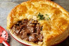 a beef pot pie with a slice cut out