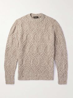 an image of a sweater with cable knits on the front and back, in beige