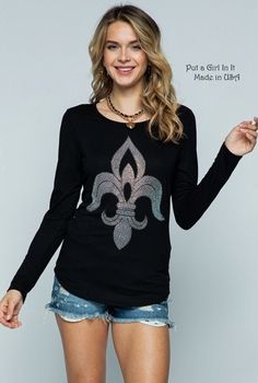 "New Womens Vocal Apparel soft black fleur de lis crystal embellished long sleeve shirt This incredibly beautiful Vocal top is just breathtaking Beautiful embellished stones make up the front fleur de lis design SO MUCH BLING on this top Super Soft, flattering and has stretch Just GORGEOUS! Made in USA by Vocal Apparel I have been selling Vocal clothing for 16 YEARS now and just LOVE this brand! 95% Rayon - 5% Spandex Material has stretch Measured without stretching - *Small - Approx. 17\" acros Black Long Sleeve Tops With Rhinestones, Stunning Tops, Tunic Shirt, Womens Tunics, Simply Beautiful, Soft Black, Womens Clothing Tops, Long Sleeve Shirt, Christmas Sweaters