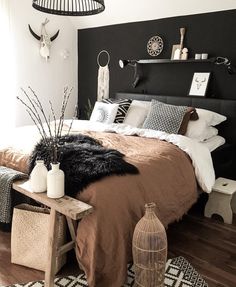 a black and white bedroom with an animal print rug