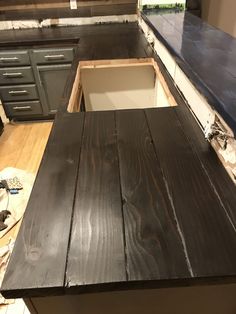 an unfinished kitchen counter top is being installed