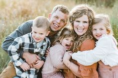 a family is posing for a photo together