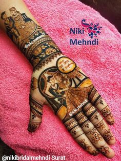 a woman's hand decorated with henna