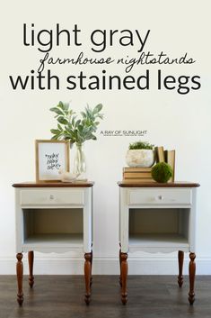 two white nightstands sitting next to each other on top of a hard wood floor