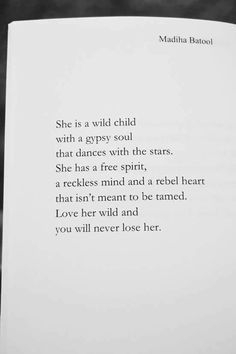 an open book with the words she is a wild child written in black and white