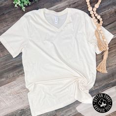 Pair with our Kimonos! We have picked out Bella Canvas v-necks to elevate the style of our new spring kimonos! Features: short sleeve v necks available in navy, black, & red unisex fit runs true to size brand: Bella Canvas Shop all Cardigan options here: https://cottonchaos.com/collections/kimonos White Cotton Short Sleeve V-neck Top, White Relaxed Fit V-neck Top, Solid Color Short Sleeve V-neck Top For Spring, Spring V-neck Top With Short Sleeves, Basic V-neck T-shirt For Spring, White Cotton V-neck Short Sleeve Top, Spring Basic Relaxed Fit V-neck Top, White Cotton V-neck Top With Short Sleeves, Spring Relaxed Fit Basic V-neck Top