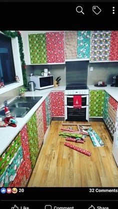 a kitchen decorated for christmas with wrapping on the counter