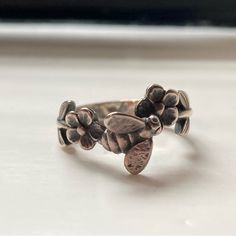 Rare Bee And Flower Three Dimensional Ring In Sterling Silver. Rwady To Gift And Just Lovely, With The Intricate Detailing Of A Bee That Sits Off The Finger. Absolutely Stunning Craftsmanship And Artistry~ It Is An Estimated Ring Size 5, 5.5 Or 6 And A Rare Collector's Piece No Longer Offered From James Avery, As It Is Retired. The James Avery Box/Dust Bag Is Not Included But It Will Be Packed In A Secure Box~ Please Look At Pictures And Feel Free To Message Me With Any Questions. Bottom Of The Band Needs Some Polishing As There Is Some Gentle Wear From This Vintage Piece Bee And Flower, Bee Flower, Bee Ring, James Avery Jewelry, Bee On Flower, The James, James Avery, Flower Ring, Womens Jewelry Rings