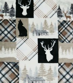 an image of a quilt with animals and trees on it