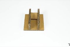 a pair of scissors sitting on top of a piece of cardboard with leopard print tape