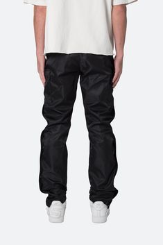 the Snap Zipper II Cargo Pants are designed with an updated relaxed fit throughout, improved, stiffer fabric, with cargo pockets at the side seam, 4 snap closures at the outseam with a zipper underneath the entire length, velcro closure at the leg opening and finished with a built in belt made of self material. details relaxed, tapered fit 100% nylon snaps and zipper at outseam model is 6’1, 140 lbs and wears a size 30 140 Lbs, Fuzzy Cardigan, Fun Pants, Denim Patches, Snow Pants, Pair Of Pants, Grey Hoodie, Flannel Shirt, Vintage Tees