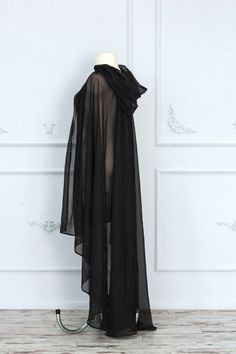 Gorgeous sheer black hooded cape made of tulle. It will make every your look mysterious and luxurious. The cape will be perfect for complementing your fantasy or gothic dress. It is possible to recreate this cape with other materials and coloring, just write to us, and we will choose the best fabric special for you. The standard back length is 55 inches (140 cm). If you want more or less, please, write to us. ♥See all cloaks and capes: https://etsy.me/2Qkhon8 =SHIPPING= We provide Standart airma