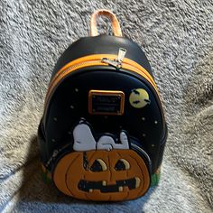 Peanuts Halloween Pumpkin Mini Backpack Themed Black Backpack For Everyday Use, Cute Halloween Travel Backpack, Novelty Black Backpack For Everyday Use, Cute Halloween Backpack For Everyday Use, Cute Halloween School Backpack, Halloween Themed Travel Backpack, Novelty Halloween School Backpack, Themed Halloween Travel Backpack, Themed Backpack For Everyday Use And Halloween