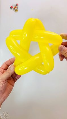 someone is holding an inflatable balloon that looks like a star ornament