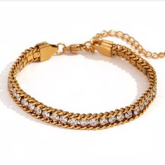 Length: 6" with a 2" extension chain Width: 6mm Material: Stainless Steel, Cubic Zirconia Plating: 18k real gold Lobster claw clasp closure Bracelet is 100% nickel-free and cadmium-free Bracelet is hypoallergenic and tarnish resistant Small Boutique, Free Bracelet, Jewelry Studio, Lobster Claws, Boutique Jewelry, Real Gold, Lobster Claw, Cubic Zirconia, Plating