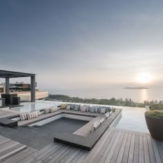 an outdoor living area overlooking the ocean