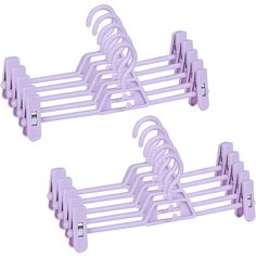 two purple clothes hangers sitting next to each other