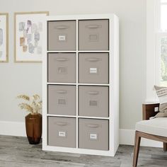 a living room filled with lots of storage containers