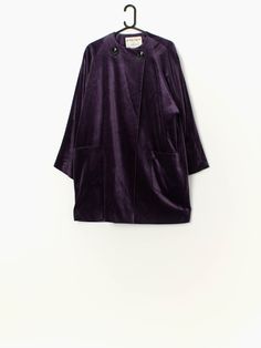 Vintage Jaeger purple velvet jacket. This bold, deep purple jacket features a large black button neck closure, two open pockets and light shoulder pads. Made in 1997 from a mid-weight cotton and rayon blend with a rayon lining.  Our recommended size: Small to Medium  Label says: UK8 / Bust 84CM 33INCH / HIP 89CM 35INCH Condition: Very good* A small repair was made on the left pocket. Please see last image (not colour accurate)  Material: 75% cotton, 25% rayon Lining material: 100% rayon Measurem Winter Velvet Outerwear With Button Closure, Purple Velvet Jacket, Purple Jacket, Velvet Jacket, Purple Velvet, The Velvet, Womens Jackets, Black Button, Deep Purple