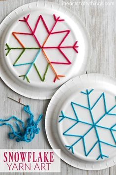 two paper plates with yarn on them that are shaped like snowflakes, and one has an arrow