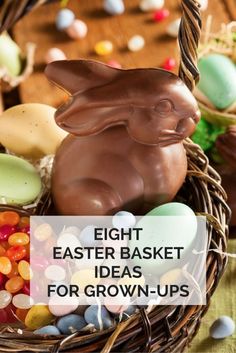 an easter basket filled with chocolate eggs and candies, including a bunny in the center