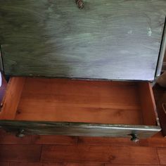 an old wooden chest is sitting on the floor