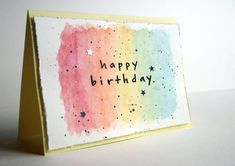 a card with the words happy birthday written on it and stars in the sky behind it