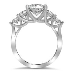 a white gold ring with three stones on it