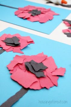 the paper flowers are cut out to make them look like they have been made with scissors