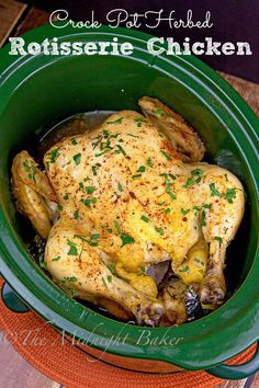 a close up of a chicken in a crock pot on a wooden table with the words rotissee chicken