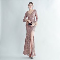 Step into timeless elegance with the Olivia Lace Long Sleeve V-Neck Sequined Maxi Dress from Hot Fashionista. This stunning gown is a beautiful fusion of delicate lace and dazzling sequins, perfect for those seeking a sophisticated and glamorous look. Fabric Composition: Dress: Sequins The Olivia Dress features a flattering V-neckline, complemented by long lace sleeves that add a romantic touch. The shimmering sequins throughout the dress create a glamorous effect, ensuring you sparkle at every angle. The maxi silhouette flows gracefully, making it ideal for formal events and evening occasions. Whether it's a wedding, gala, or upscale event, the Olivia Lace Long Sleeve V-Neck Sequined Maxi Dress pairs perfectly with elegant accessories and heels. Let this dress make your evening unforgetta Winter Prom V-neck Evening Dress, V-neck Winter Formal Evening Dress, Winter Formal V-neck Evening Dress, Winter Evening V-neck Dress, Elegant Pink Holiday Gown, Long Lace Sleeves, Short One Piece, Sale Clothes, Ladies Accessories