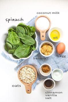 ingredients to make spinach salad laid out in bowls