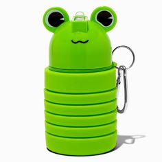 a green frog shaped water bottle with eyes on it's side and a keychain hanging from the front