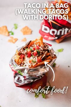 two bags of nachos sitting next to each other on top of a table