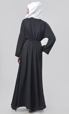 A well chemistry of simplicity in modest wear. The abaya includes gathers detailing on body and very beautiful bishop sleeves for enhancing the look and included pockets for better utility. Color: AS PICTURED Pattern: Normal Abaya Abaya Type: FRONT NECK DEEP PREFER TO WEAR YOUR OWN MATCHING INNER FOR YOUR BETTER LOOK Work: Intricate beads and dori (and work color will be common in all other colors as shown in an image) ATTACHED DORI WITH TESSELS Fabric : KASHIBO This Abaya Has V-Neckline and Ful Long Sleeve Modest Abaya With Modesty Panel, Modest Long Sleeve Abaya With Modesty Panel, Long Sleeve Abaya With Modesty Panel For Fall, Fall Long Sleeve Abaya With Modesty Panel, Maxi Length Abaya For Fall Workwear, Fall Workwear Abaya In Maxi Length, Fall Workwear Maxi Length Abaya, Modest Long Sleeve Thobe With Modesty Panel, Modest Abaya With Modesty Panel