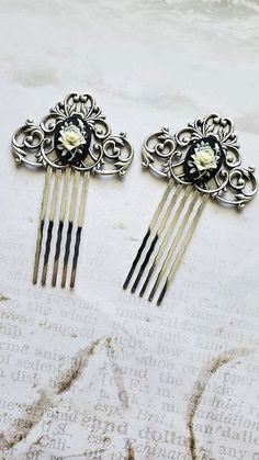 2 Piece Rose Cameo Pair Haircomb  This Rose Cameo Pair Haircomb makes a lovely hair accessory for beautiful hair styles. This hair Comb is charming with elegant and amazing cream Flowers on a black Baroque Framework. It is great for special occasions like weddings, but can also be great for everyday wear.  ☻Link to The ENTIRE SHOP: https://www.etsy.com/shop/FashionCrashJewelry?ref=shopsection_shophome_leftnav&ga_search_query=crystal%2Bnecklace Our Motto ~ Happy Customers Are Awesome Let us know Antique Hair Pins, Vintage Hair Pieces, Black Hair Pieces, Feminine Hair, White Hair Accessory, Antique Hair Combs, Black Hair Bows, Decorative Hair Combs, Silver Hair Comb