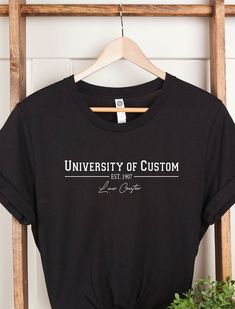 Custom University Law School Shirts, Custom University Name T-shirts,  Personalized University Shirt, Your University Tee, Personalized Gift WELCOME TO "BesTeeShirts" ! High quality and super soft, comfortable shirt. Made with top of the line vinyl and pressed with a professional grade heat press. All our simple color ones like White, Black, and Red are 100% Cotton. All our Heathered Colors are cotton/polyester blend and they are super comfy soft!   SIZING AND COLORS Make sure you check our size Custom Text Cotton Graphic Tee, Custom Text Graphic Tee In Cotton, Casual T-shirt With Custom Text For College, Casual Custom Text T-shirt For College, Casual College T-shirt With Custom Text, Black Short Sleeve Top With Custom Text, College Crew Neck Shirt With Custom Print, Custom Print Crew Neck T-shirt For College, University Shirt