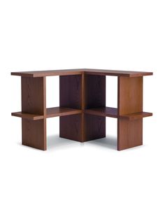 the corner table is made from wood and has three shelves on each side, with one section