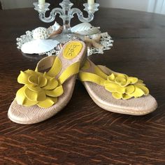 Boc: Yellow Flower Sandals Size 6 Never Worn Decorative Yellow Leather Flower Cushioned Soles Casual Floral Print Wedge Sandals, Spring Synthetic Round Toe Flip Flops, Synthetic Round Toe Flip Flops For Spring, Spring Slip-on Flat Wedge Sandals, Summer Flower-shaped Synthetic Sandals, Flower Shaped Synthetic Heels For Summer, Synthetic Summer Heels With Flower Design, Summer Flower Heels In Synthetic Material, Summer Flower Sandals In Synthetic Material