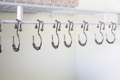 there are many hooks hanging on the wall